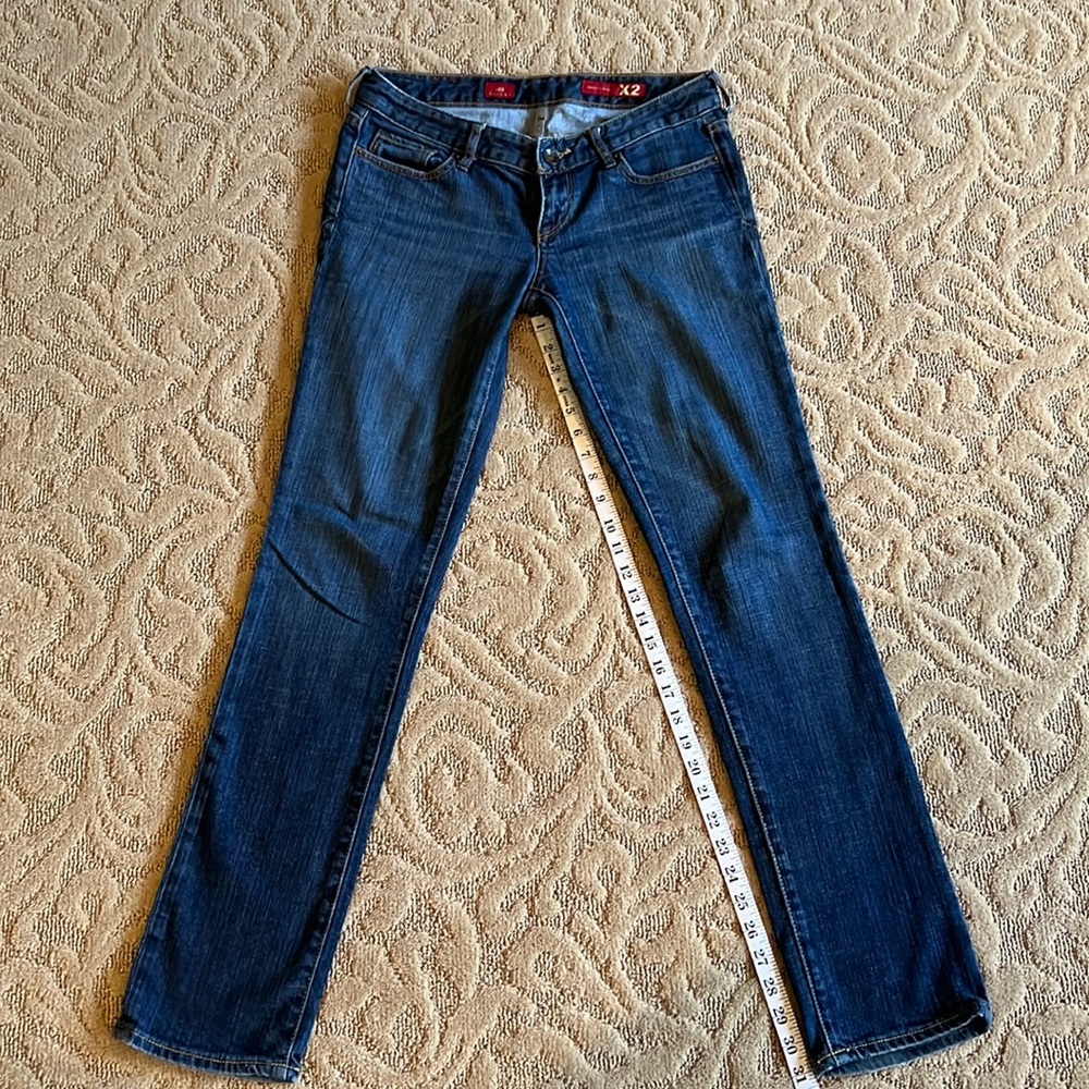 X2 skinny jeans with gold color stitching. Size 6L
